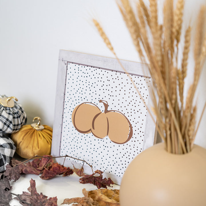 Pumpkin tablet with polka dot background
