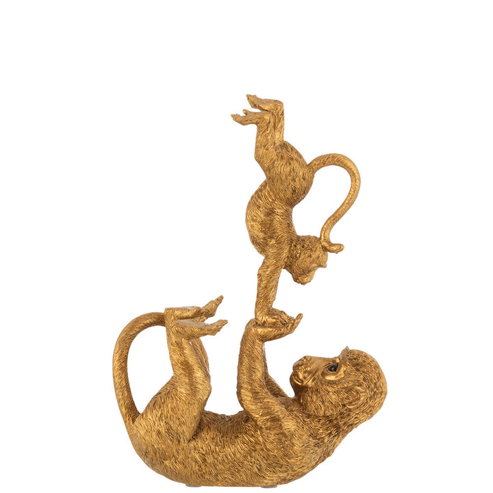 Balancing monkeys in gold resin