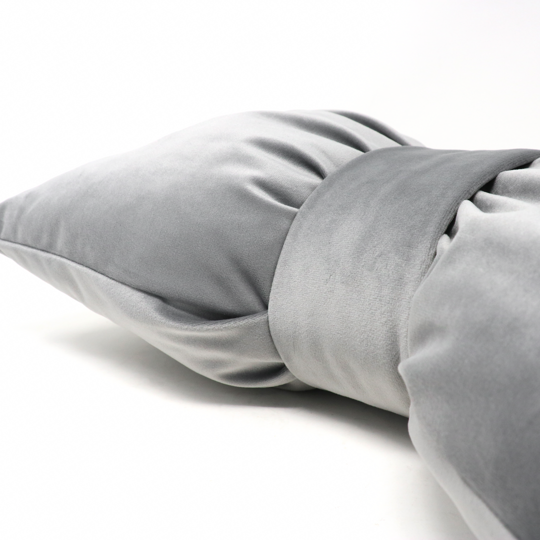 Bow cushion in gray velvet